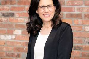 Carol Fishman Cohen Heashot Brick Background Large